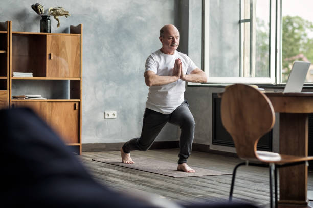 Elderly Man doing Yoga Indoor