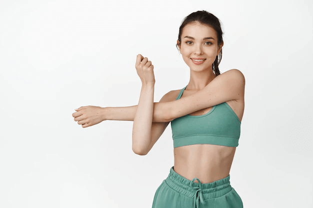Smiling fit fitness girl stretching arms