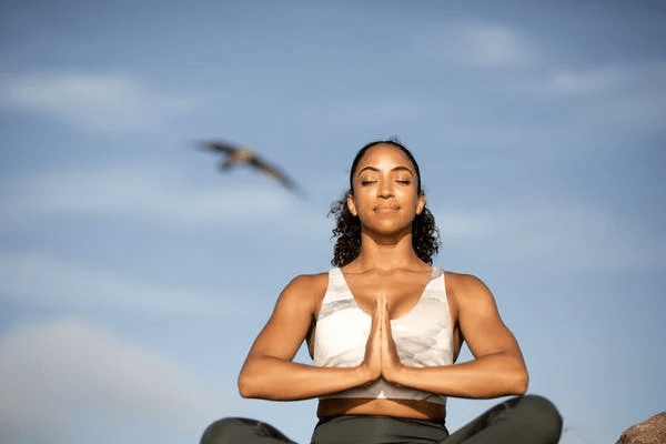 Woman Doing Yoga Wearing Sports Bra