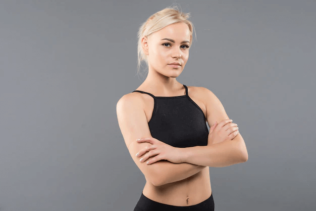 A woman in a black high impact sports bra