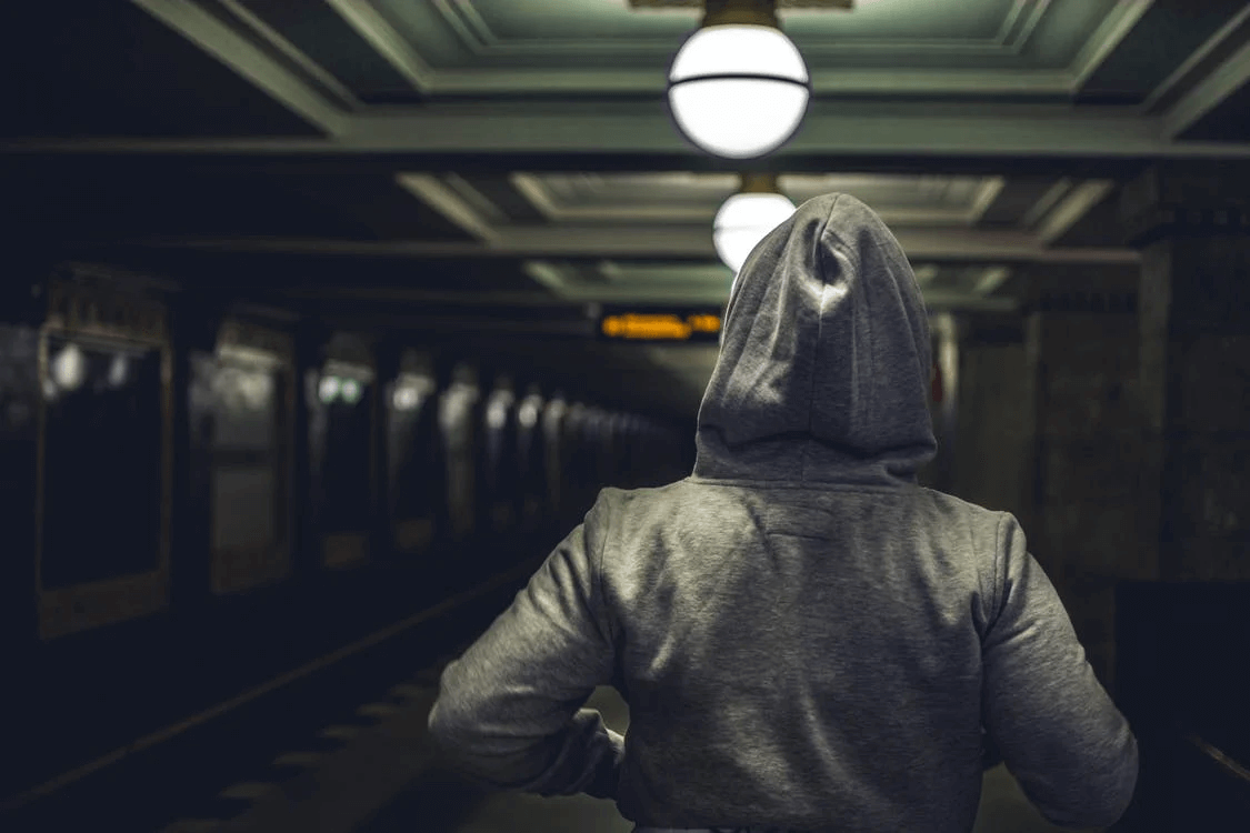 Person Wearing Gray Hooded Jacket