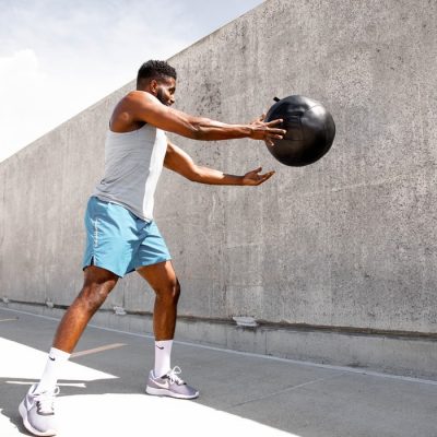 Sporting Activity with Big Black Ball