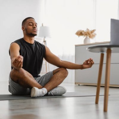 Young Man doing Yoga Indoor